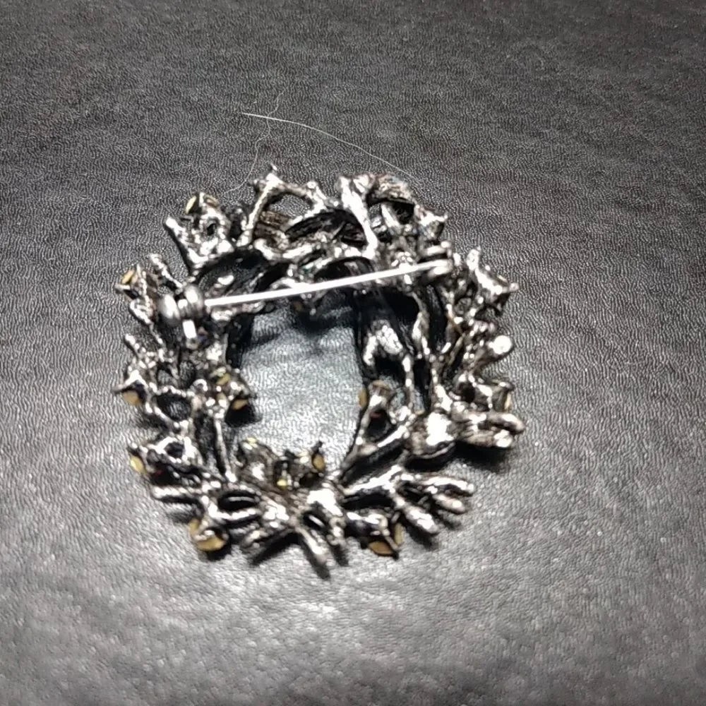 Silver tone holiday wreath brooch